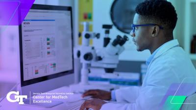 researcher in a lab at a computer