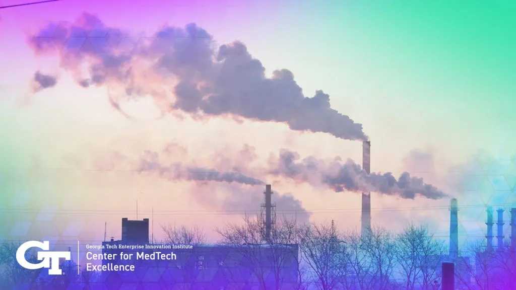 distance shot of factory and smoke stacks